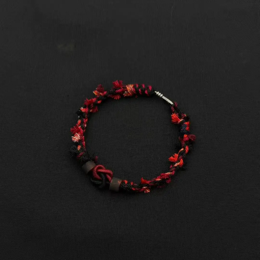 Himalayan Blessing: Handwoven Tibetan Lucky Knot Bracelet with Sacred Charms regular scarlet