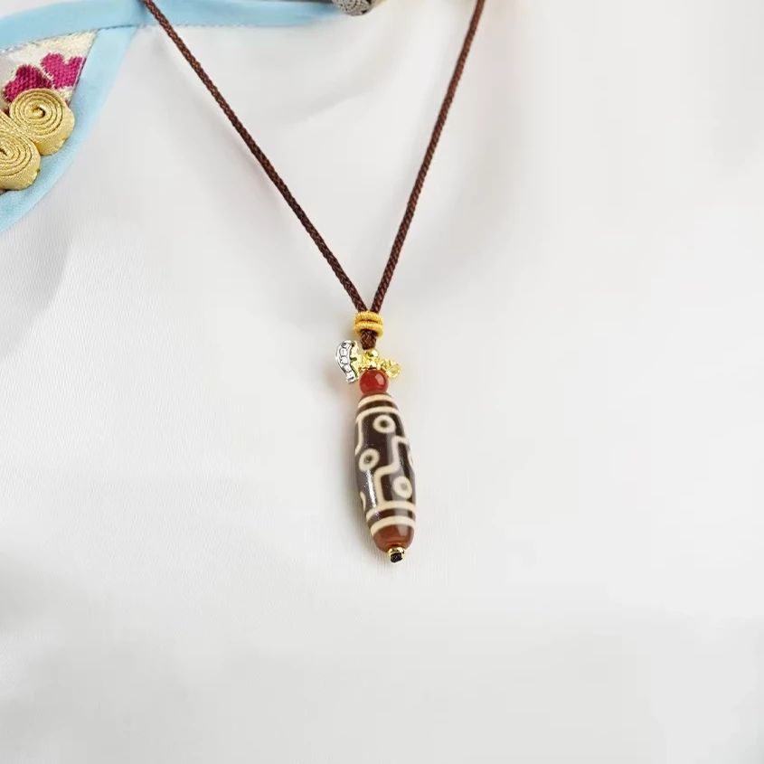 Authentic Tibetan Hand-Braided Dzi Bead Amulet Necklace – Sacred Talisman for Harmony, Luck, and Positive Energy - Lifestyle Display
