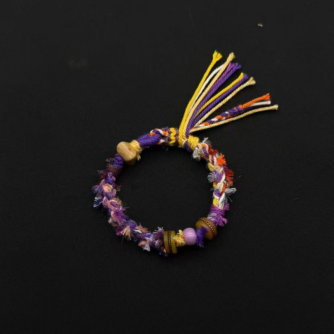 Himalayan Blessing: Handwoven Tibetan Lucky Knot Bracelet with Sacred Charms regular violet