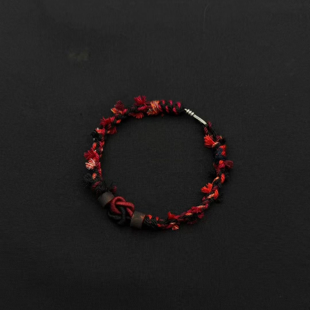 Himalayan Blessing: Handwoven Tibetan Lucky Knot Bracelet with Sacred Charms regular scarlet