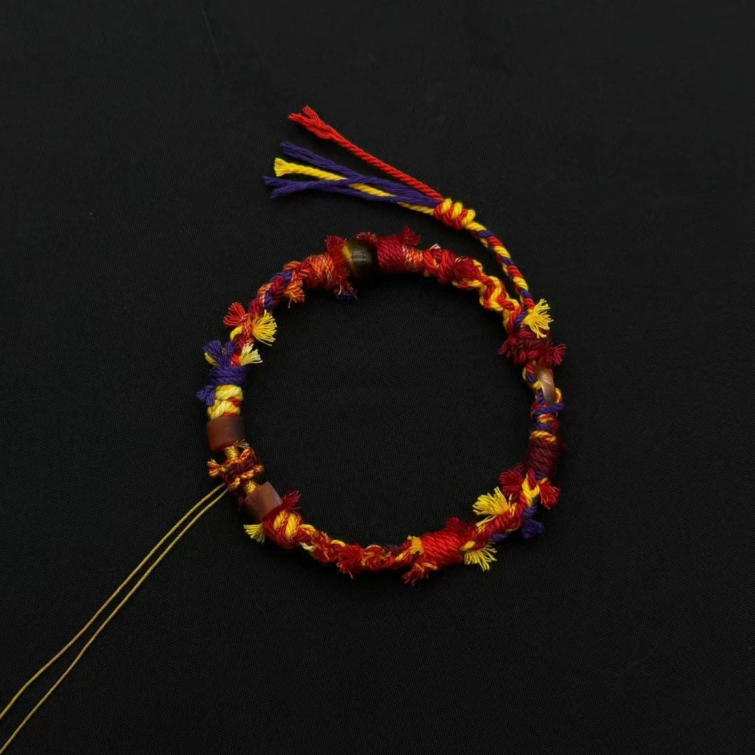 Himalayan Blessing: Handwoven Tibetan Lucky Knot Bracelet with Sacred Charms regular sunflower